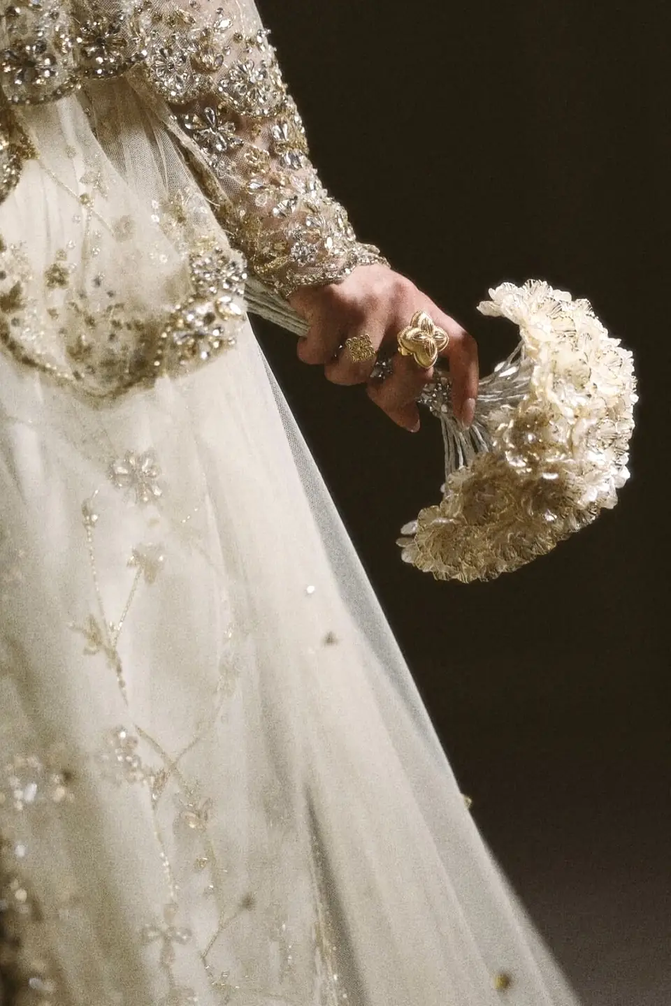 Crystal-embroidered sleeve and softly beaded bridal skirt in ivory tulle