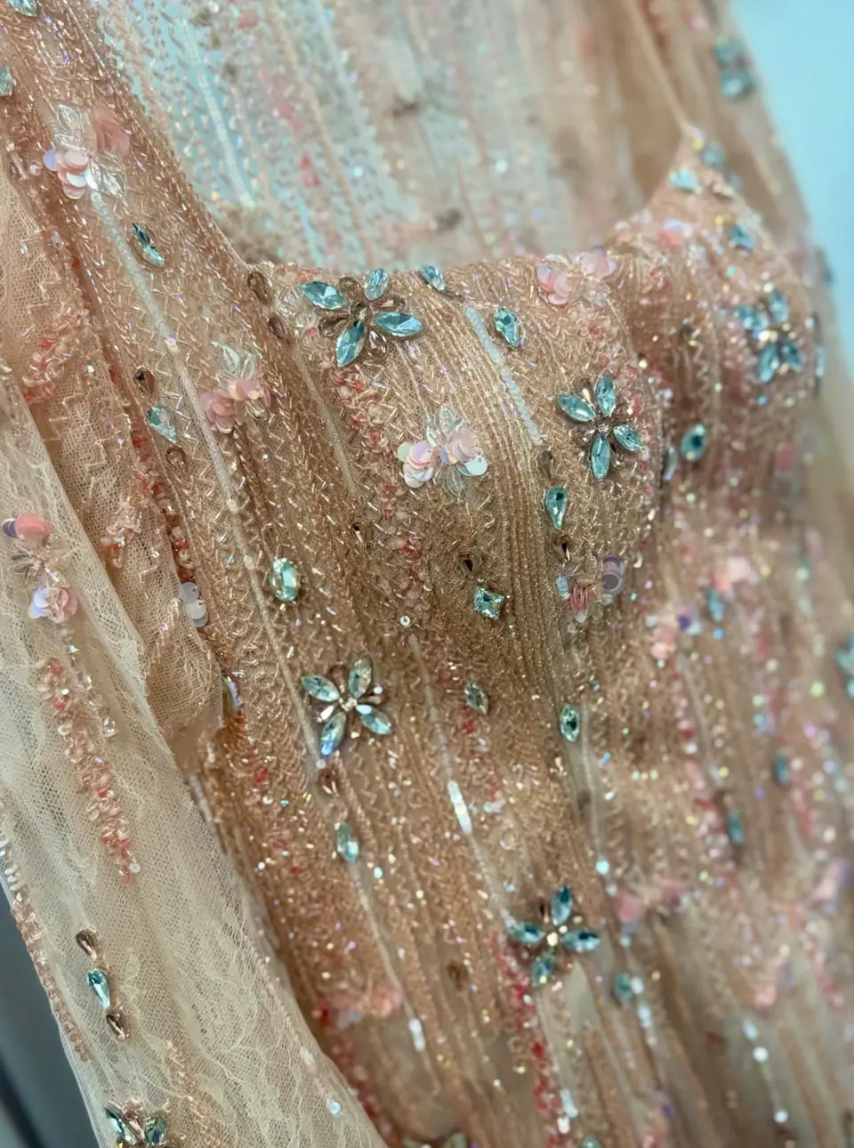 Peach beaded bodice with aqua crystal flowers and pink sequin blossoms