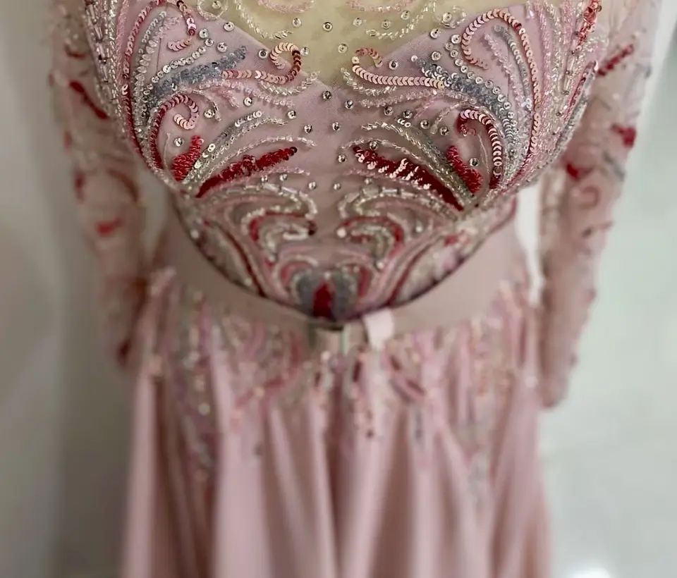 Pink gown with a swirling sequin and bead bodice in rose, red and silver