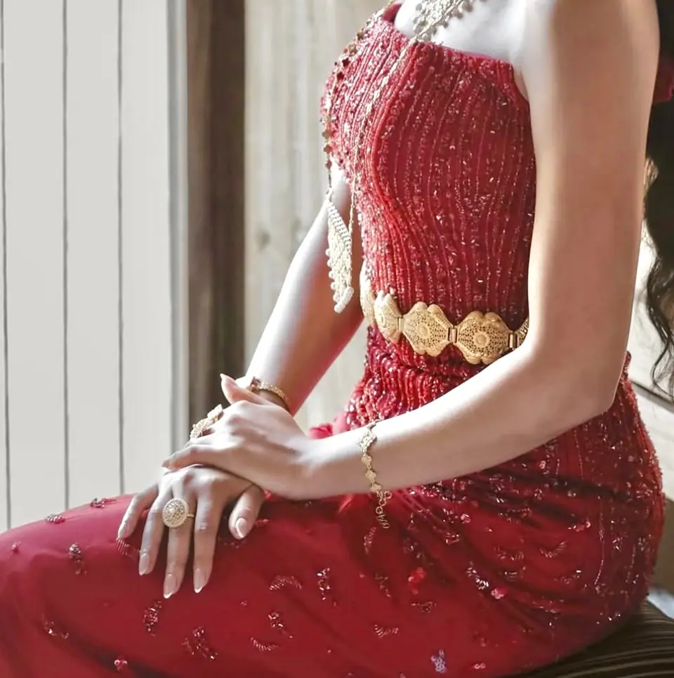 Red bugle-beaded bodice with a gold filigree belt